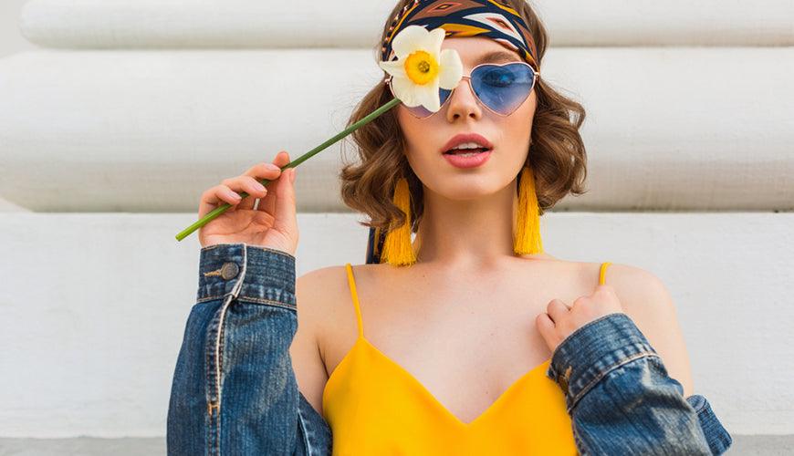 beautiful sexy woman in yellow stylish dress wearing denim jacket