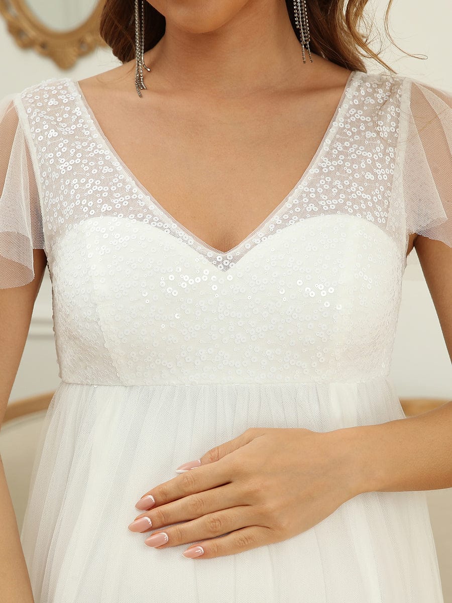 Sequin Sweetheart Sheer Flutter Sleeve Tulle Empire Waist Bump Friendly Dress #Color_White Sequin Sweetheart Sheer Flutter Sleeve Tulle Empire Waist Maternity Dress