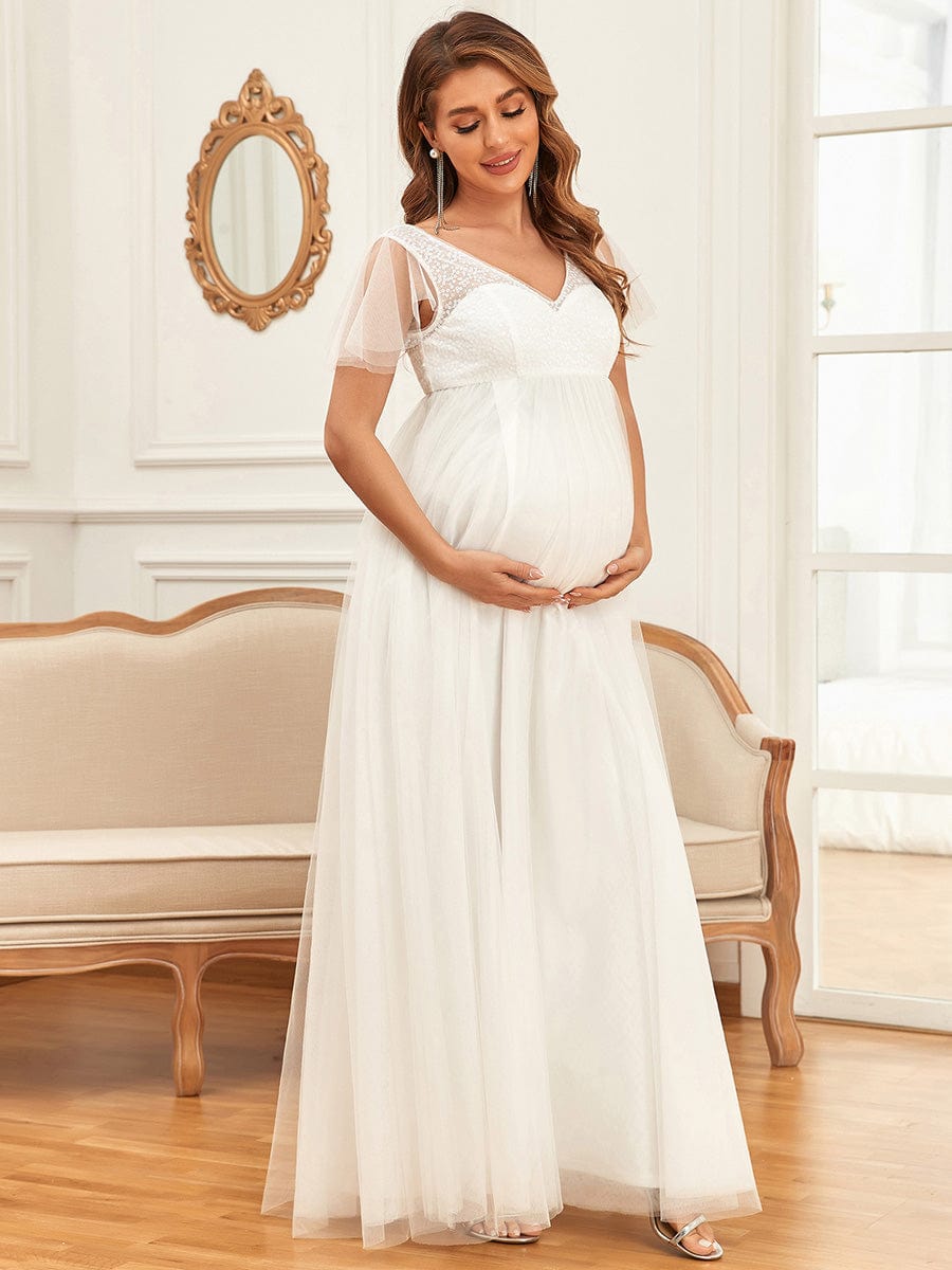 Sequin Sweetheart Sheer Flutter Sleeve Tulle Empire Waist Bump Friendly Dress #Color_White Sequin Sweetheart Sheer Flutter Sleeve Tulle Empire Waist Maternity Dress