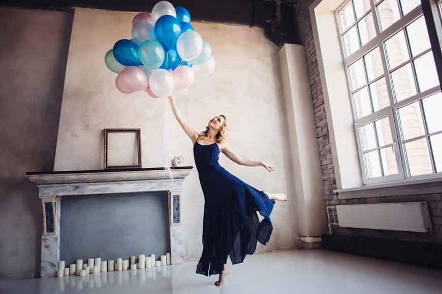 a-girl-wearing-a-navy-blue-dress-is-dancing