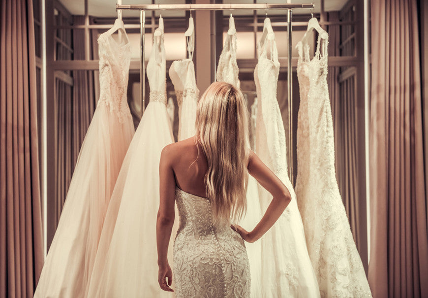 a-women-is-choosing-her-wedding-dress